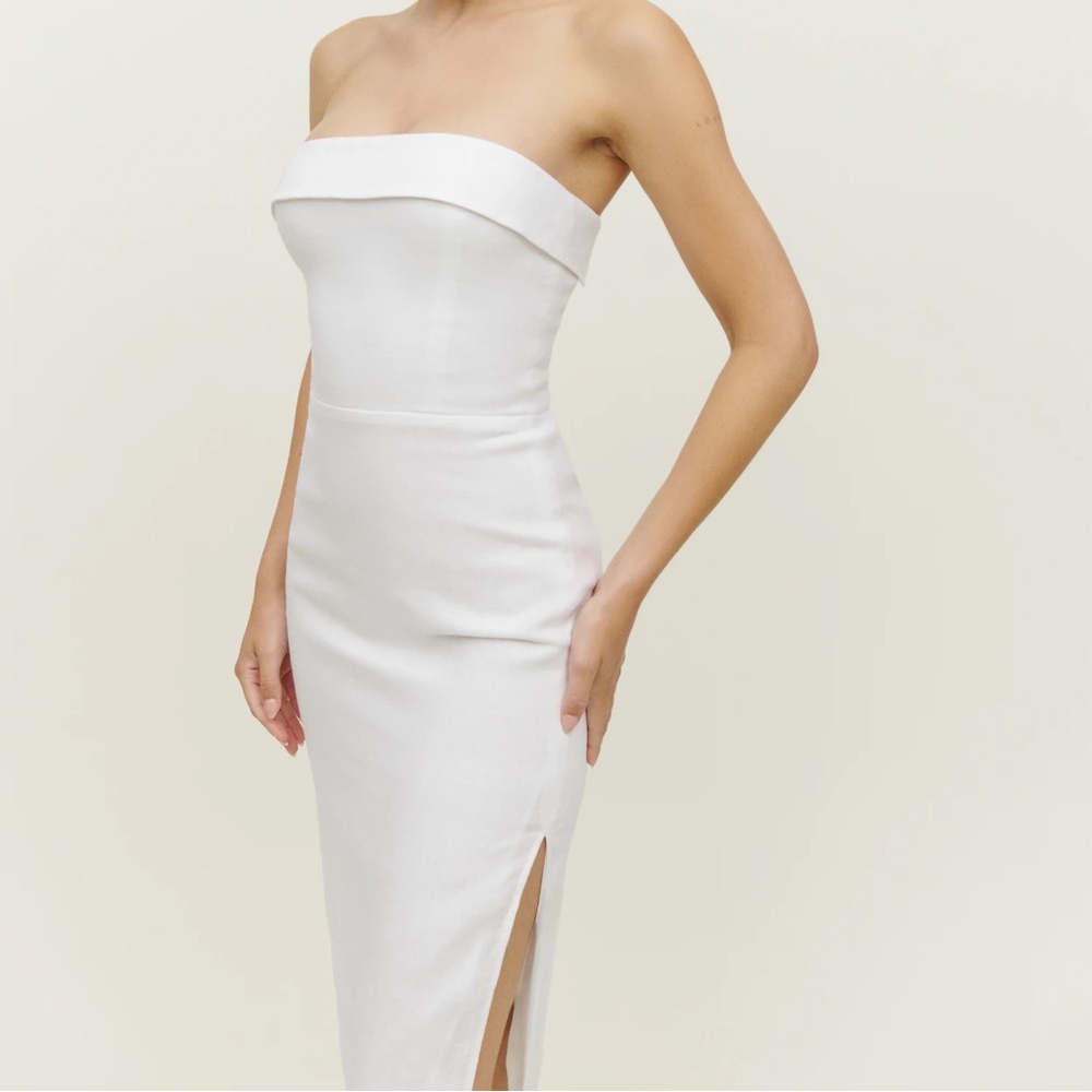 The Marcella is a strapless, midi dress, with a smocked back bodice.